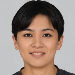 Joyful asian young-adult female with short  black hair and brown eyes