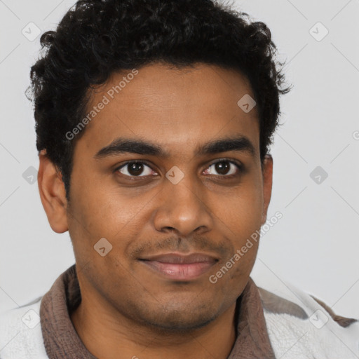 Joyful black young-adult male with short  brown hair and brown eyes