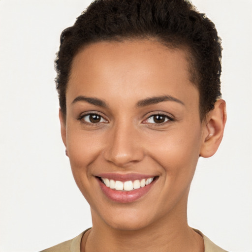 Joyful latino young-adult female with short  brown hair and brown eyes