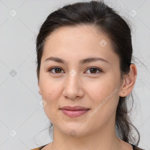 Joyful white young-adult female with long  brown hair and brown eyes