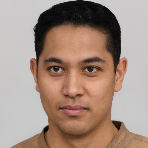 Neutral latino young-adult male with short  black hair and brown eyes