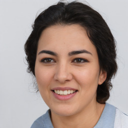 Joyful asian young-adult female with medium  brown hair and brown eyes