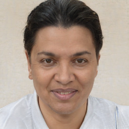 Joyful white adult female with short  brown hair and brown eyes