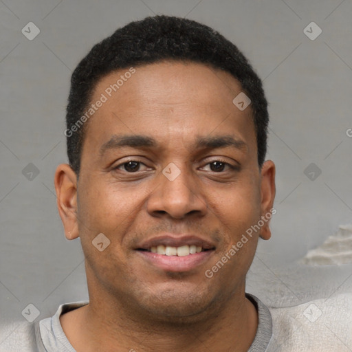 Joyful latino young-adult male with short  brown hair and brown eyes