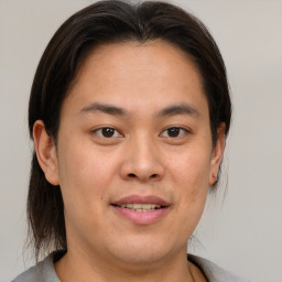 Joyful white young-adult male with medium  brown hair and brown eyes