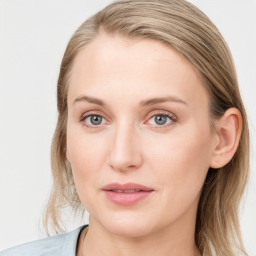 Joyful white young-adult female with medium  brown hair and blue eyes