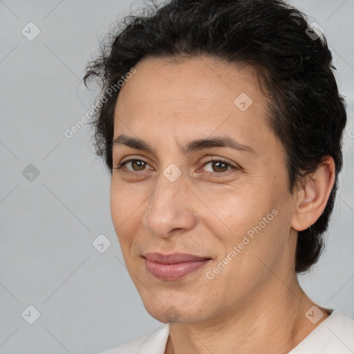 Joyful white adult female with short  brown hair and brown eyes