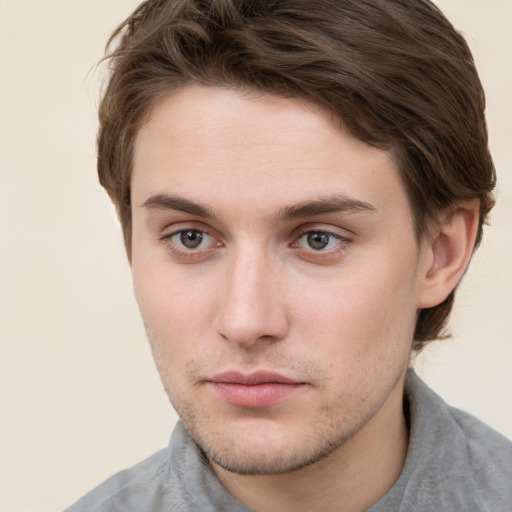 Neutral white young-adult male with short  brown hair and grey eyes