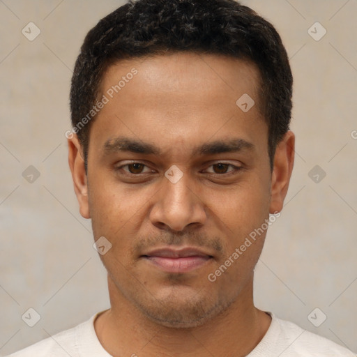 Joyful latino young-adult male with short  brown hair and brown eyes