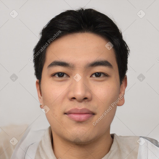 Joyful asian young-adult male with short  black hair and brown eyes