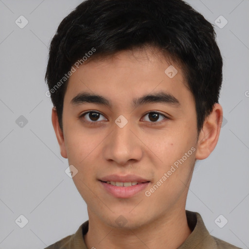 Joyful asian young-adult male with short  brown hair and brown eyes