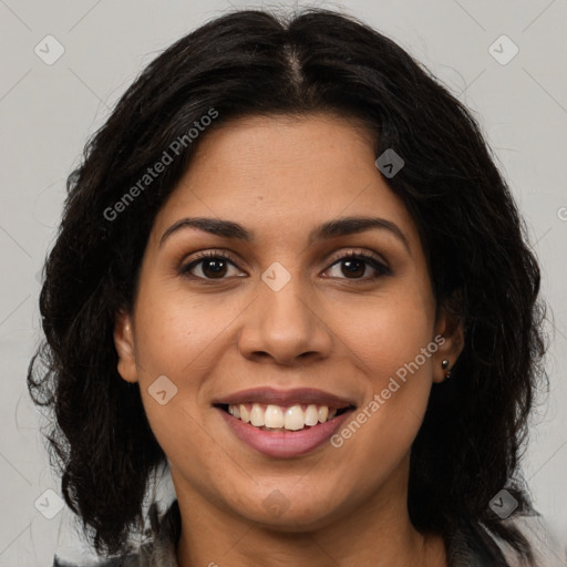 Joyful latino young-adult female with long  brown hair and brown eyes