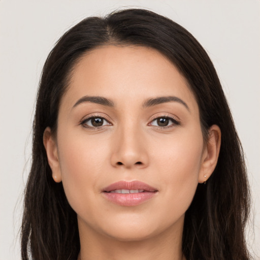 Joyful white young-adult female with long  brown hair and brown eyes