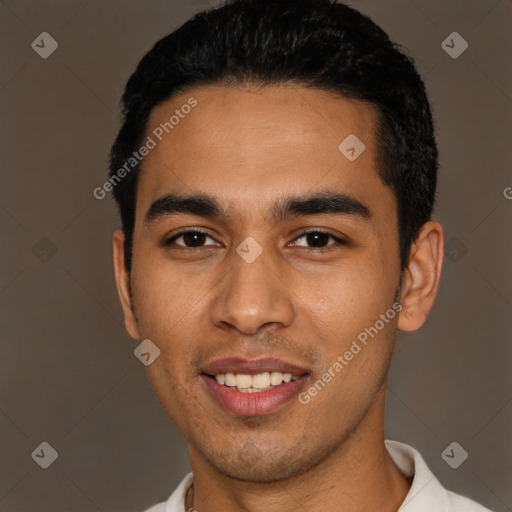 Joyful latino young-adult male with short  black hair and brown eyes