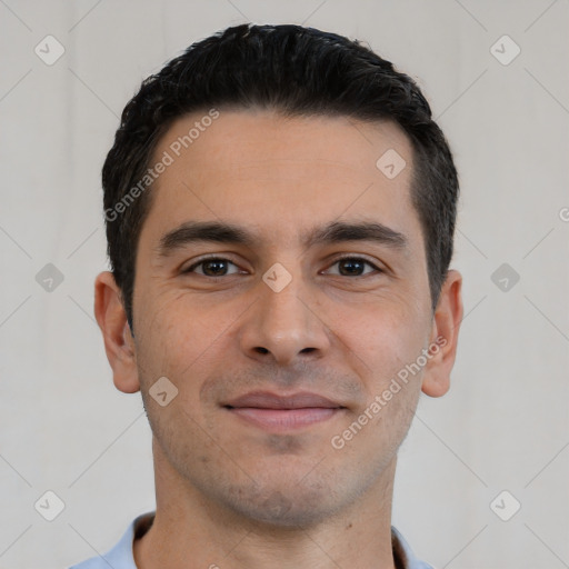 Joyful white young-adult male with short  black hair and brown eyes