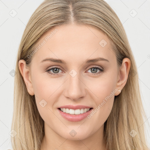 Joyful white young-adult female with long  brown hair and grey eyes