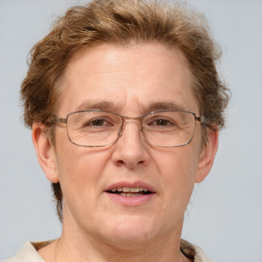 Joyful white middle-aged male with short  brown hair and blue eyes