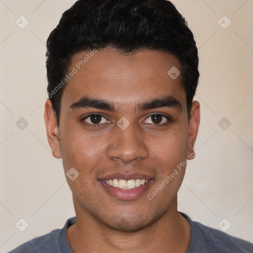 Joyful latino young-adult male with short  black hair and brown eyes