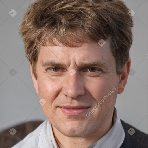 Joyful white middle-aged male with short  brown hair and brown eyes