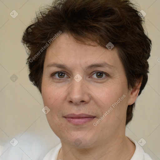 Joyful white adult female with short  brown hair and brown eyes