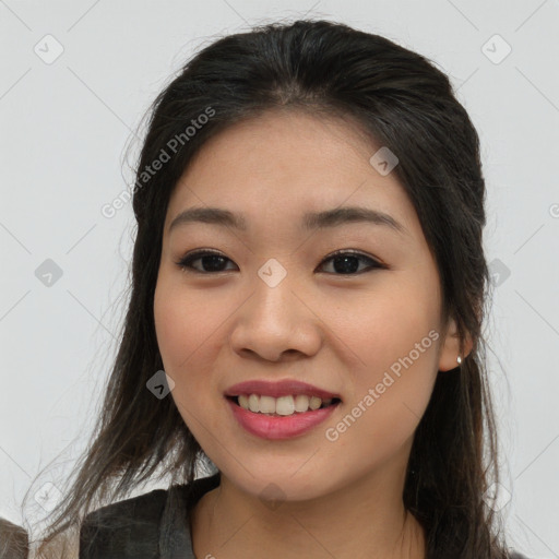 Joyful asian young-adult female with long  brown hair and brown eyes