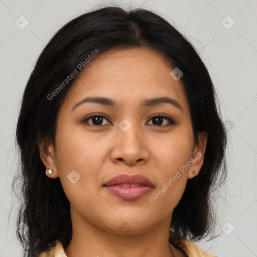 Joyful latino young-adult female with medium  brown hair and brown eyes