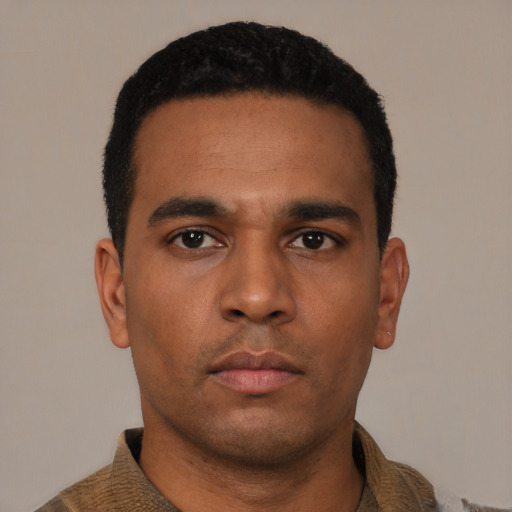Neutral latino young-adult male with short  black hair and brown eyes