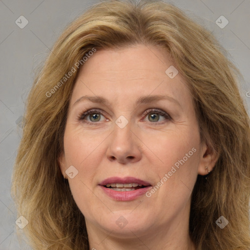 Joyful white adult female with medium  brown hair and brown eyes