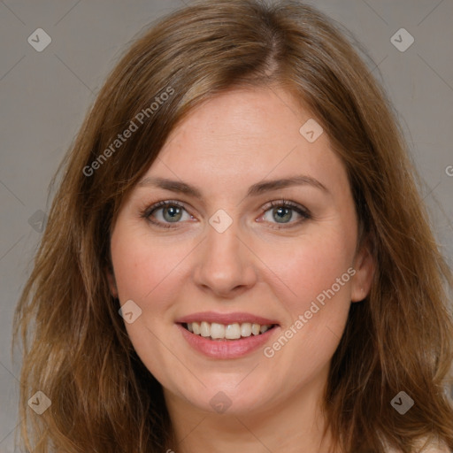 Joyful white young-adult female with long  brown hair and green eyes