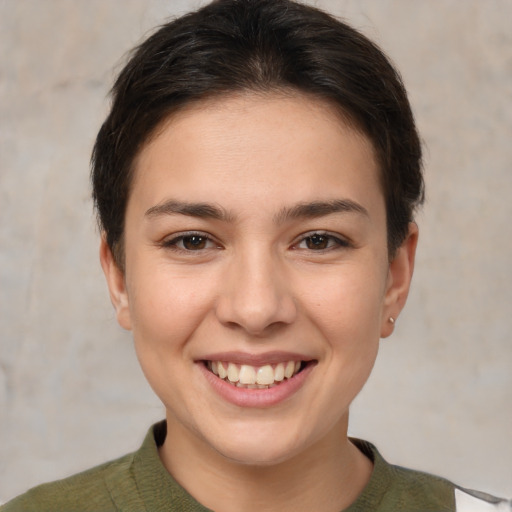 Joyful white young-adult female with short  brown hair and brown eyes