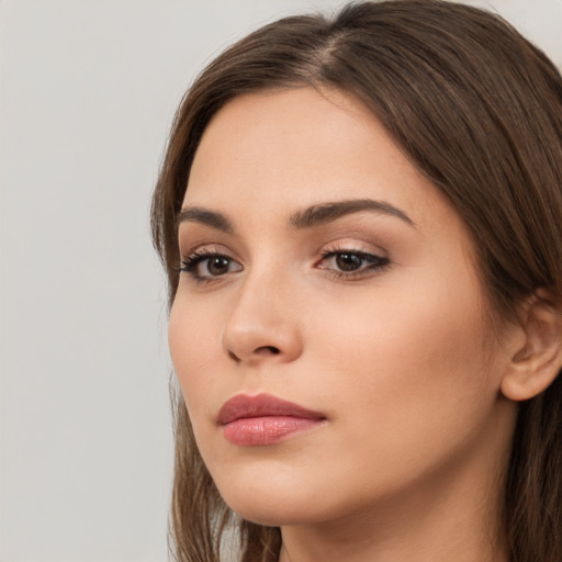 Neutral white young-adult female with long  brown hair and brown eyes