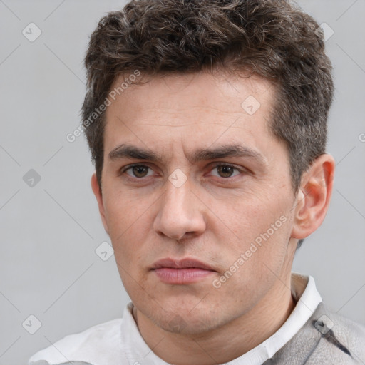 Neutral white adult male with short  brown hair and brown eyes