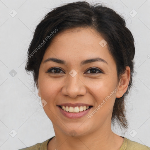 Joyful latino young-adult female with medium  brown hair and brown eyes