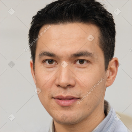 Joyful white adult male with short  black hair and brown eyes