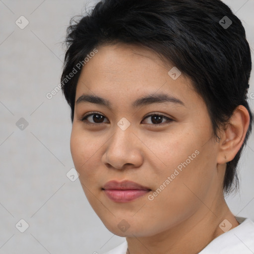 Joyful asian young-adult female with short  brown hair and brown eyes