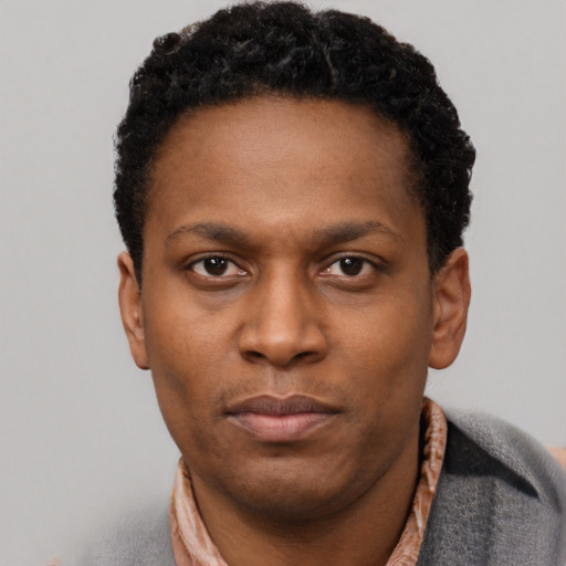 Neutral black young-adult male with short  brown hair and brown eyes