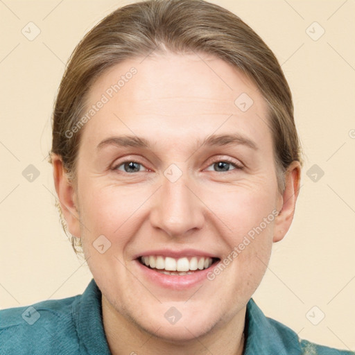 Joyful white adult female with short  brown hair and grey eyes