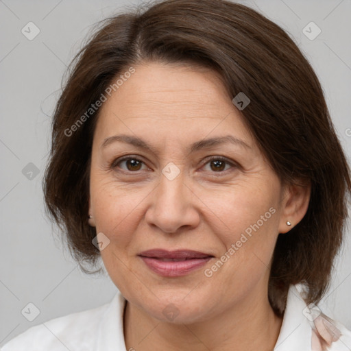 Joyful white adult female with medium  brown hair and brown eyes