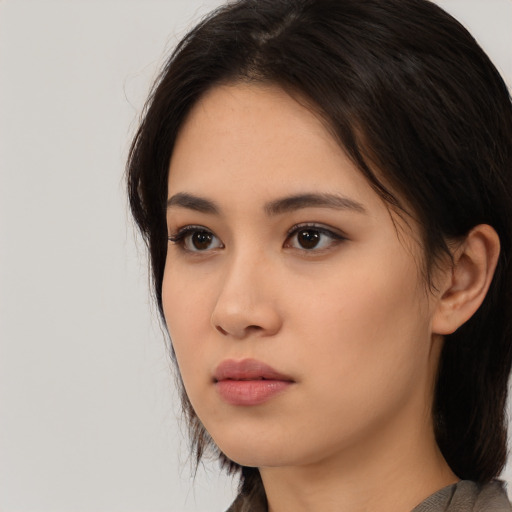 Neutral asian young-adult female with medium  brown hair and brown eyes