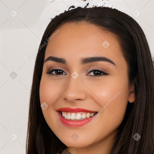 Joyful white young-adult female with long  black hair and brown eyes