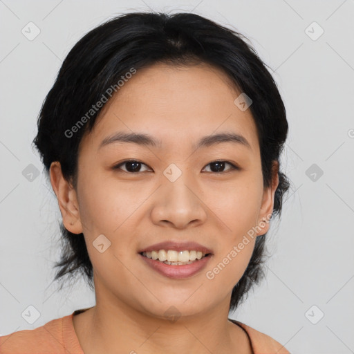 Joyful asian young-adult female with medium  black hair and brown eyes