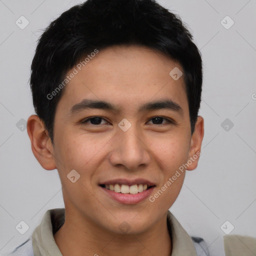 Joyful asian young-adult male with short  brown hair and brown eyes