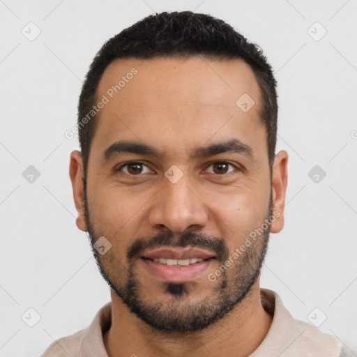 Joyful latino young-adult male with short  black hair and brown eyes