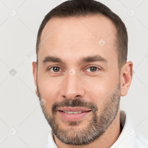 Joyful white young-adult male with short  brown hair and brown eyes