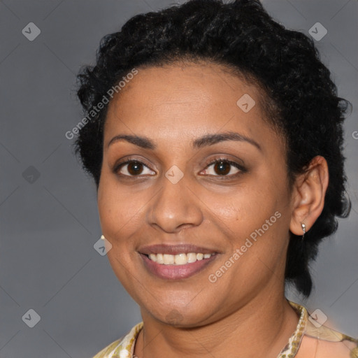 Joyful black young-adult female with short  brown hair and brown eyes