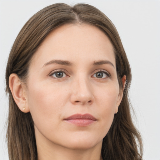 Joyful white young-adult female with long  brown hair and grey eyes