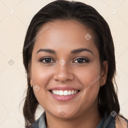 Joyful white young-adult female with long  brown hair and brown eyes