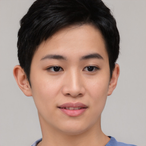 Joyful asian young-adult female with short  black hair and brown eyes