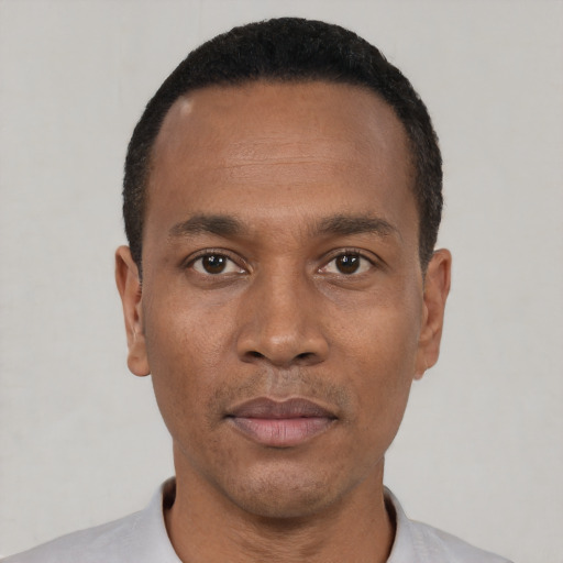 Neutral black young-adult male with short  black hair and brown eyes