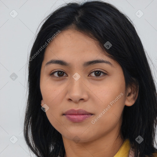 Joyful latino young-adult female with long  black hair and brown eyes